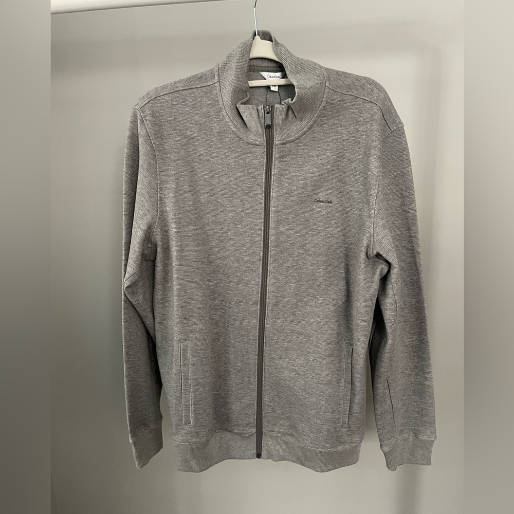 NWT Calvin Klein zip up.
